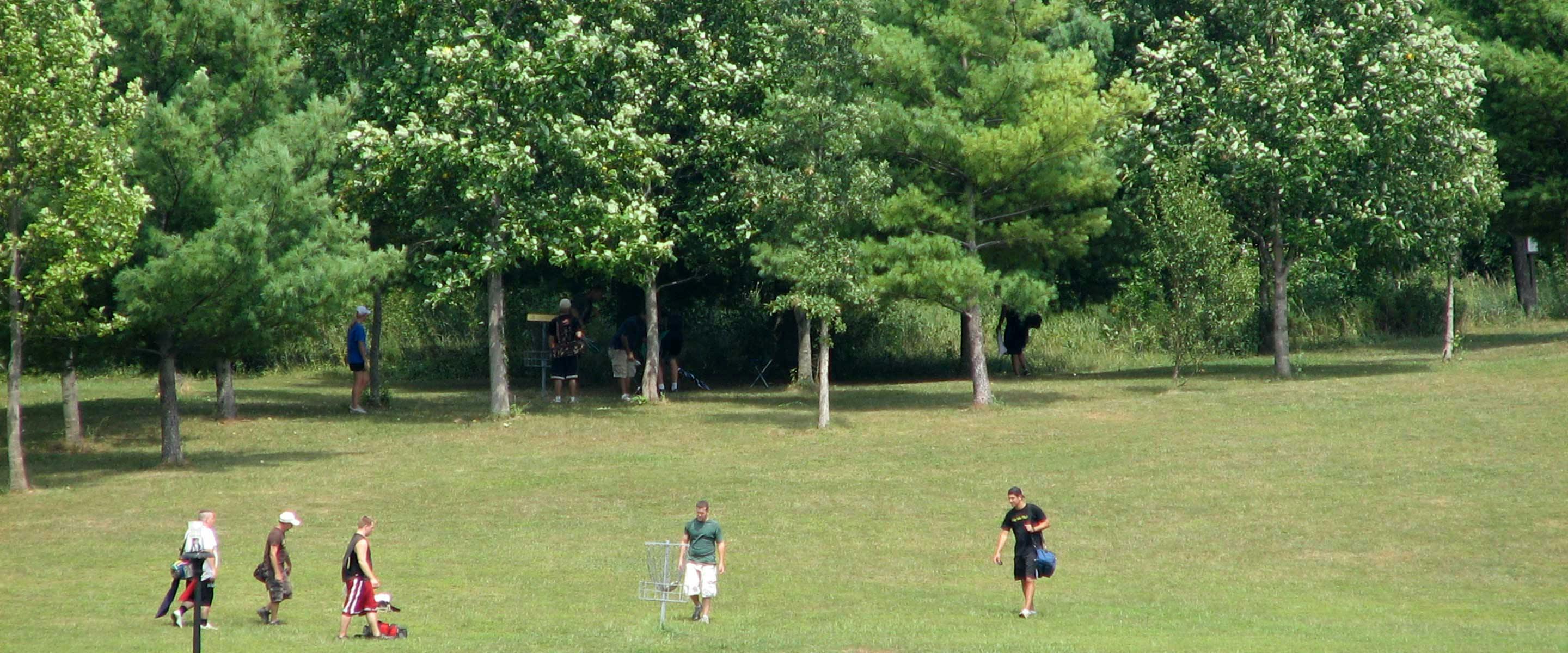Multiple groups playing on the large frisbee golf disc course