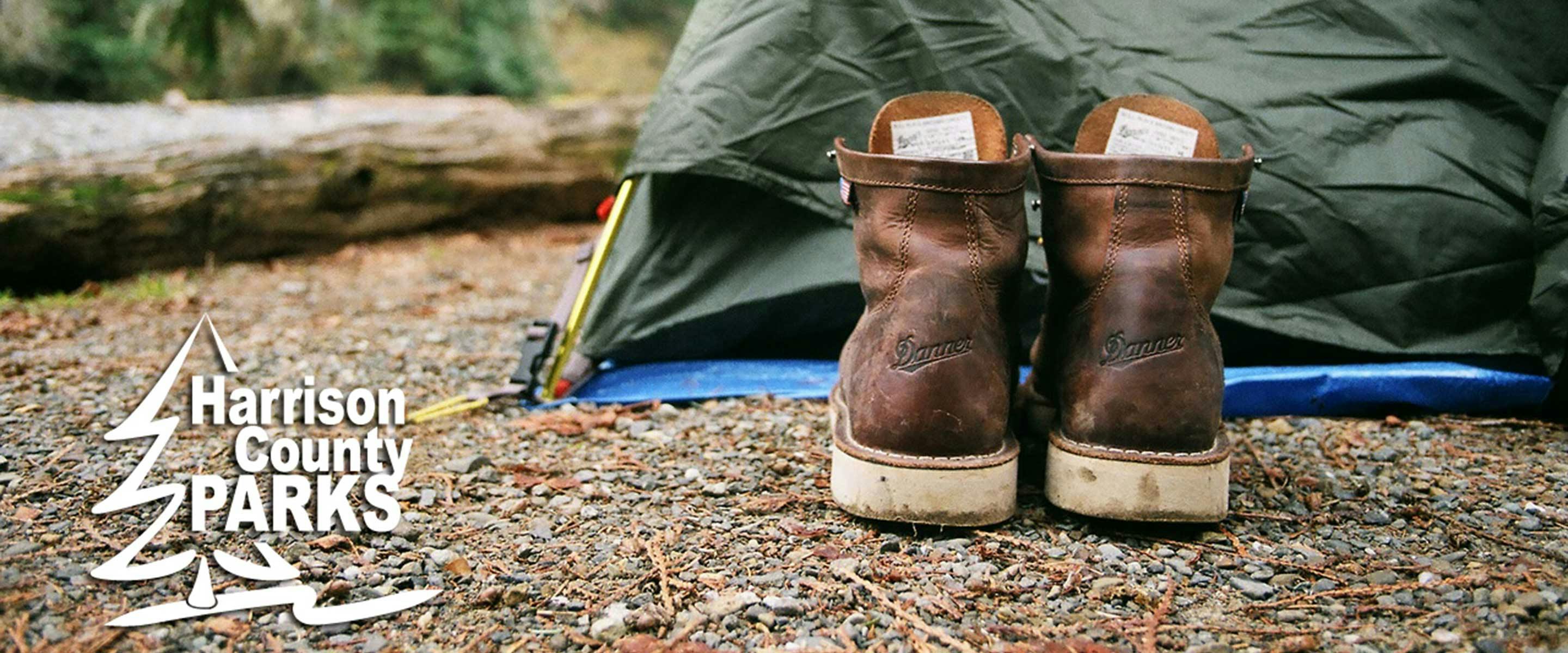 hiking boots outside a tent
