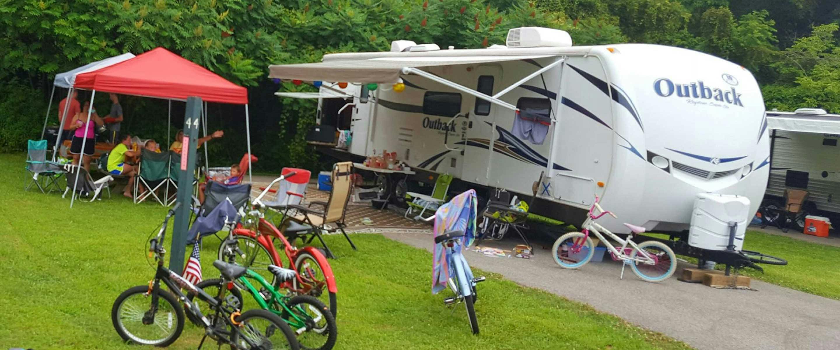 group of people brought kids bikes to campground